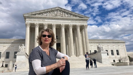 Landee Holloway in front of the Supreme Court Building in Washington DC